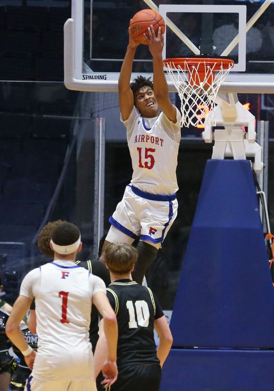 Fairport’s Noah Meabon slams a reverse alley-oop dunk against Rush-Henrietta during their Section V Class AAA boys basketball sectional finals Saturday, March 7, 2026 at Blue Cross Arena in Rochester.