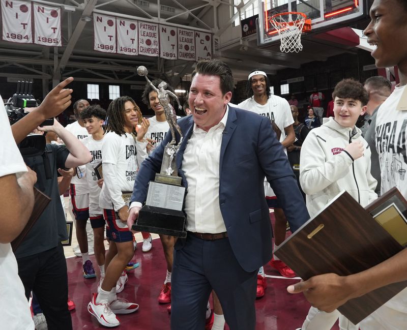Stepinac coach Patrick Massaroni celebrates with his team after defeating Cardinal Hayes 72-59 in the CHSAA AA championship game at Fordham University in the Bronx March 8, 2026.
