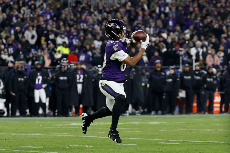 Jan 11, 2025; Baltimore, Maryland, USA; Baltimore Ravens tight end Isaiah Likely (80) makes a catch against the Pittsburgh Steelers in the second quarter in an AFC wild card game at M&T Bank Stadium. Mandatory Credit: Geoff Burke-Imagn Images