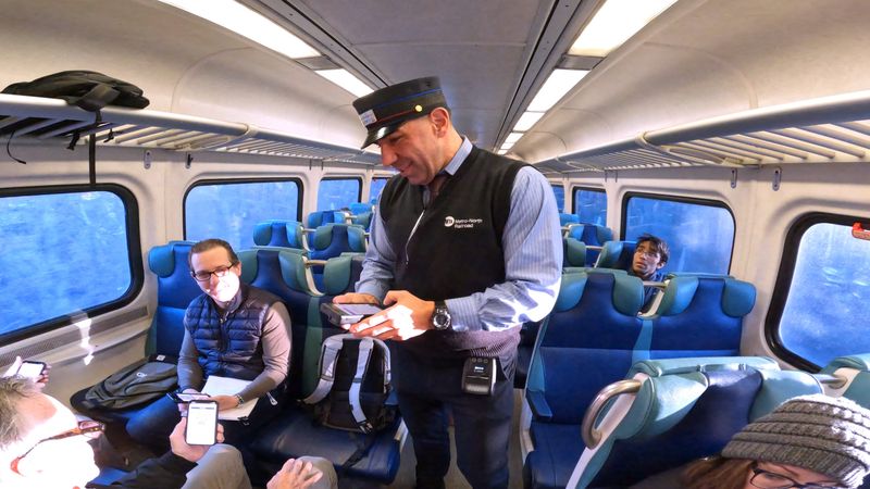 Metro-North conductor Anthony Aprea checks tickets and talks to passengers on a train headed to Manhattan from Hartsdale March 9, 2026.