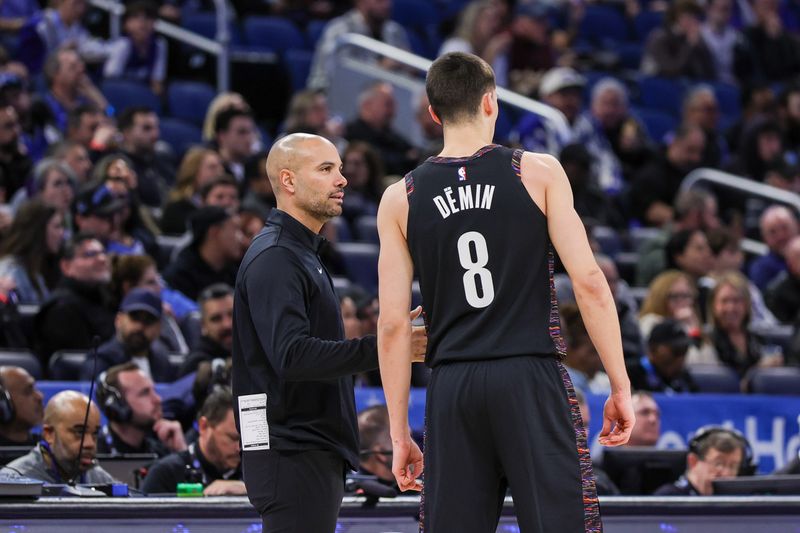 Feb 5, 2026; Orlando, Florida, USA; Brooklyn Nets head coach Jordi Fernandez talks to guard Egor Demin (8) during the first quarter against the Orlando Magic at Kia Center. Mandatory Credit: Mike Watters-Imagn Images