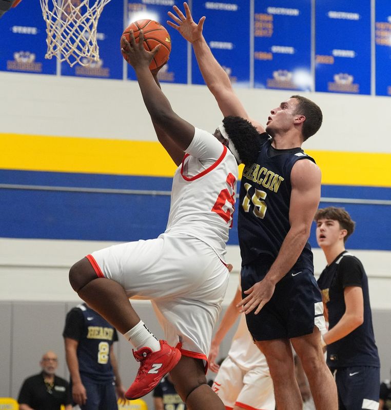 Tappan Zee's Timothy Alexandre (24) works around Beacon's Ryan Landisi (15) during the boys Class A subregional basketball game at Mahopac High School in Mahopac on Tuesday, March 10, 2026.