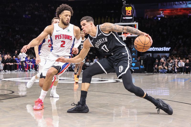 Mar 10, 2026; Brooklyn, New York, USA; Brooklyn Nets forward Michael Porter Jr. (17) looks to drive past Detroit Pistons guard Cade Cunningham (2) in the first quarter at Barclays Center. Mandatory Credit: Wendell Cruz-Imagn Images