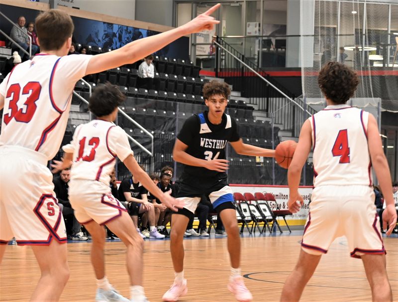 Westhill's Eli Prince prepares his next move against New Hartford during a 2024 Downtown Classic game in Utica. Westhill won its fourth consecutive Section III title over the weekend and plays a regional Sunday against Franklin Academy of Malone.