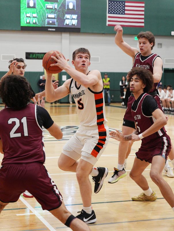 Mamaroneck’s Will Plunkett (15) drives to the basket against Kingston during the boys Class AAA subregional at Yorktown High School March 11, 2026.