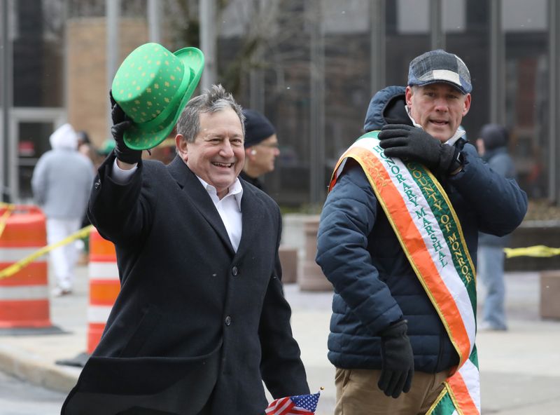 US Congressman Joseph Morelle and Monroe County Executive Adam Bello wave to the crowd along E Main St during the Tops St. Patrick’s Day Parade in downtown Rochester Saturday, March 14, 2026.