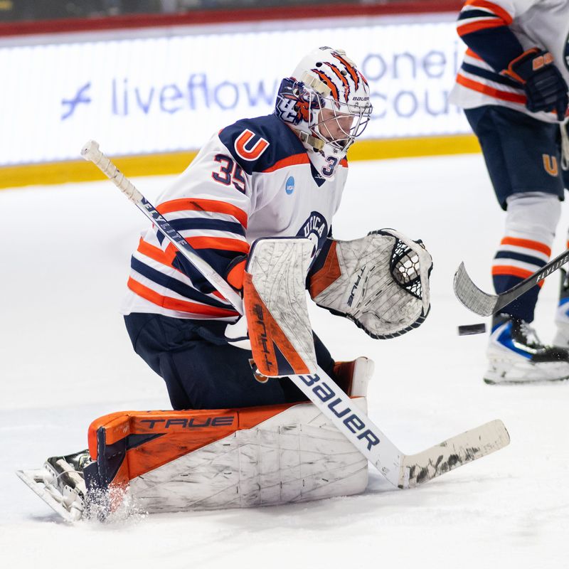Utica University goaltender Kyle Curtin keeps his eyes on a shot that goes wide during the first round of the NCAA's Division III men’s ice hockey tournament at the Adirondack Bank Center in Utica. Curtin and the Pioneers shut out Williams College <arch 14 and play at home again in the quarterfinals.
