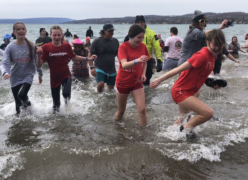 Was Canandaigua Lake cold on March 15? You betcha, as these participants in the Canandaigua Polar Plunge can attest.