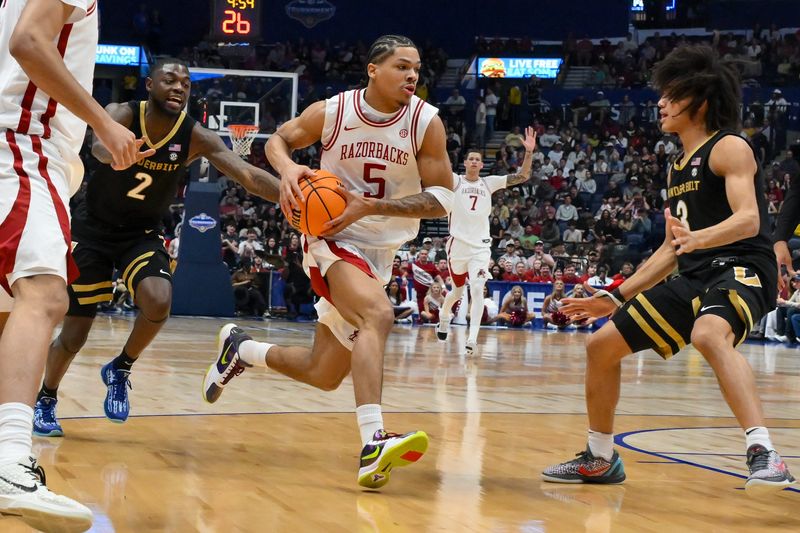 Mar 15, 2026; Nashville, TN, USA; Arkansas Razorbacks guard Darius Acuff Jr. (5) drives to the basket as Vanderbilt Commodores guard Tyler Tanner (3) defends during the men's SEC Conference Tournament Championship at Bridgestone Arena. Mandatory Credit: Steve Roberts-Imagn Images