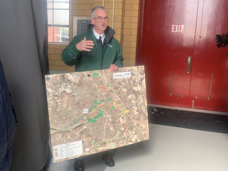 Timothy Walsh, Region 8 director for the state Department of Environmental Conservation, talks about flood control facilities in the Elmira area during a tour of local sites Tuesday, March 17, 2026.