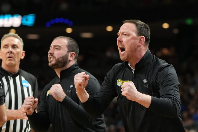Mar 19, 2026; Greenville, SC, USA; Siena Saints head coach Gerry McNamara reacts in the first half during a first round game of the men's 2026 NCAA Tournament at Bon Secours Wellness Arena. Mandatory Credit: Bob Donnan-Imagn Images