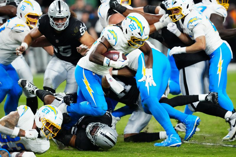 Sep 15, 2025; Paradise, Nevada, USA; Los Angeles Chargers running back Najee Harris (22) rushes the ball during the second quarter against the Las Vegas Raiders at Allegiant Stadium. Mandatory Credit: Stephen R. Sylvanie-Imagn Images
