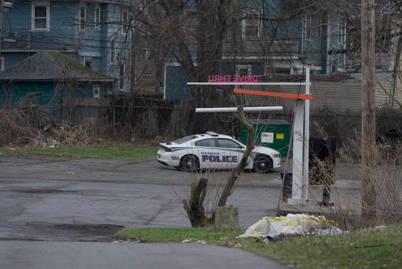 A Rochester police officer was shot after stepping out of his vehicle to talk to a man walking on Lake Avenue south of Driving Park Avenue and was injured in the lower body on March 20, 2026. The officer was taken to Rochester General Hospital with injuries not considered life threatening. Police found a male who had been hiding in brush in the 700 block of Lake Avenue who they believe was the man who shot at the officer. The male shot and killed himself after a police drone shined a light on him. Police are continuing the investigation in the area, an officer's vehicle is seen parked in the far corner of the Dunkin Donut's parking lot on Lake Avenue.