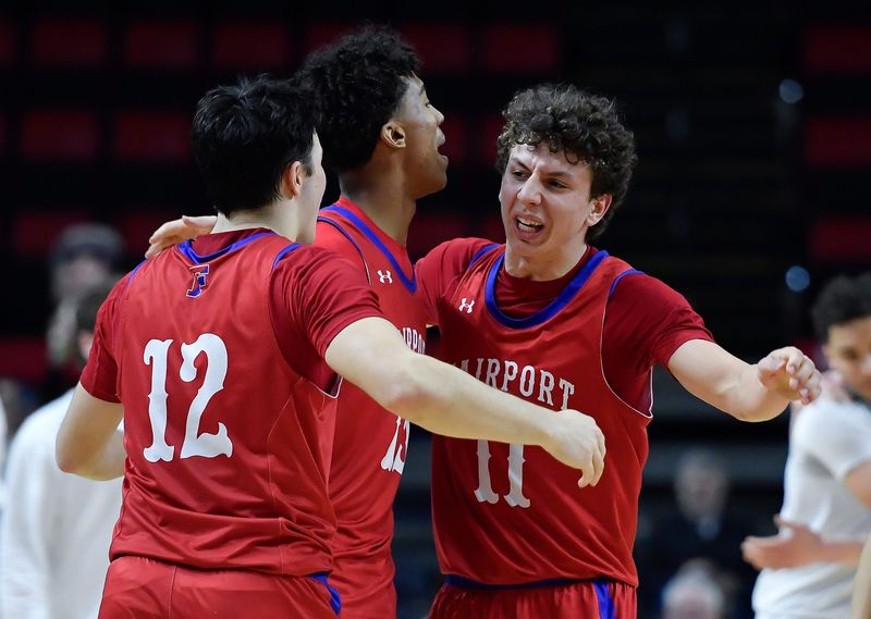 Fairport's Sam Roselli, right, celebrates with Noah Meabon, center, and Jon Roessel after their win in a NYSPHSAA Class AAA Boys Basketball Championship semifinal Friday, March 20, 2026 in Binghamton, N.Y. Fairport advanced to the Class AAA final with a 79-72 win over Corning-Painted Post (IV).