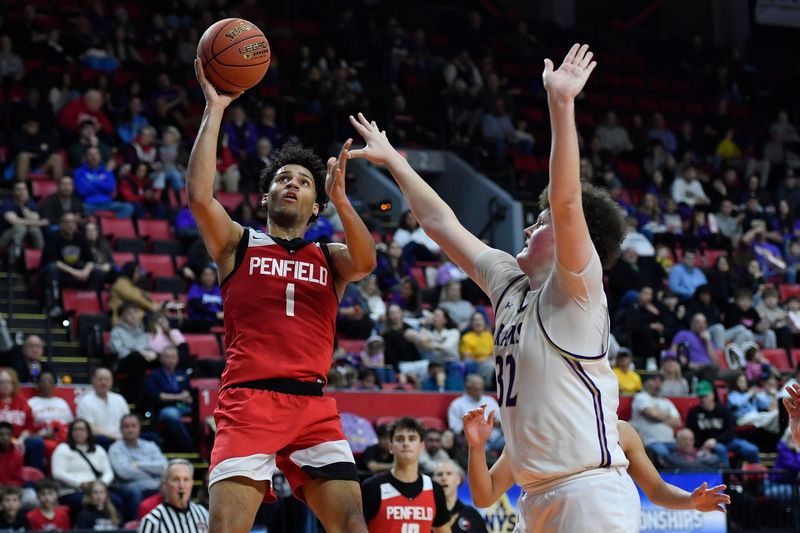 Penfield's Jackson Green (1) is defended by Amsterdam's CJ Miller (32) during the NYSPHSAA Boys Basketball Championships Class AA final Saturday, March 21, 2026, in Binghamton, N.Y. Penfield won the Class AA title with a 62-54 win over Amsterdam (II).