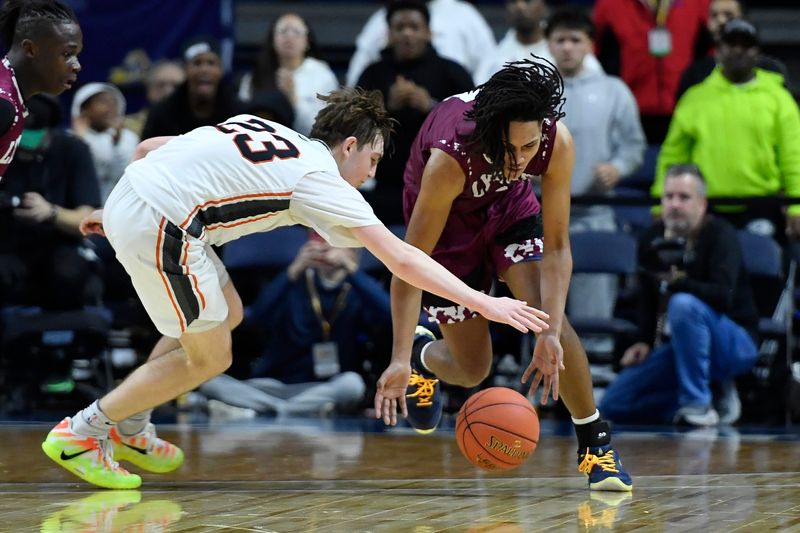 Lyons' Steven Lebrecht, right, reaches for a loose ball against Cooperstown's Miles Nelen during a NYSPHSAA Boys Basketball Championships Class C semifinal Saturday, March 21, 2026, in Binghamton, N.Y. Lyons' season ended with a 66-64 loss to Cooperstown (III).