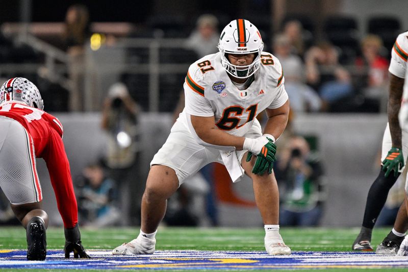 Dec 31, 2025; Arlington, TX, USA; Miami Hurricanes offensive lineman Francis Mauigoa (61) gets into position during the 2025 Cotton Bowl and quarterfinal game of the College Football Playoff at AT&T Stadium. Mandatory Credit: Jerome Miron-Imagn Images