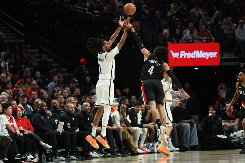 Mar 23, 2026; Portland, Oregon, USA; Brooklyn Nets forward Ziaire Williams (1) shoots the ball over Portland Trail Blazers guard/forward Matisse Thybulle (4) during the first half at Moda Center. Mandatory Credit: Jaime Valdez-Imagn Images