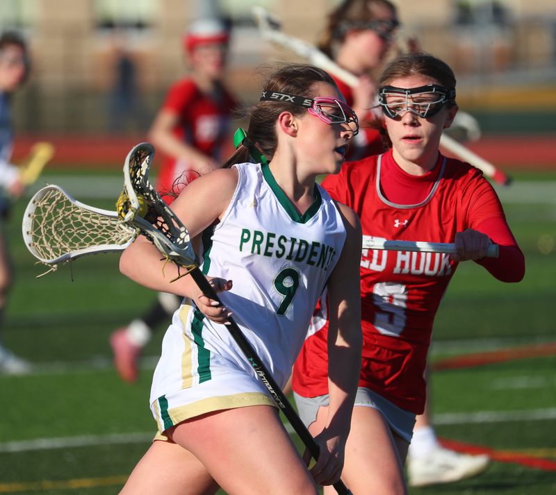 FDR’s Sadie Finn is covered by Red Hook’s Anna Finch during Tuesday’s girls lacrosse game in Hyde Park on March 24, 2026.