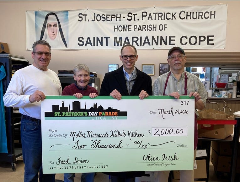 Food Drive Co-Chairs Bernie Adorino, Chris Hoke, Utica St. Patrick's Day Parade Representative Frank Cagnina present $2K check for cash donations to Utica St. Patrick's Day Parade Food Drive to Mother Marianne's Westside Kitchen Director Mike Pilat.