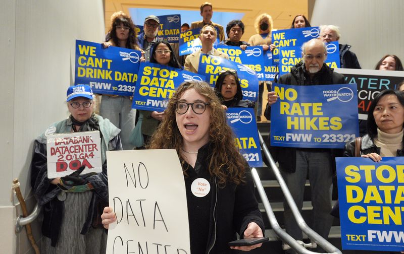 Melissa Hoffmann of Food and Water Watch speaks with a group protesting the DataBank center expansion before an Orangetown planning board session at town hall March 25, 2026.
