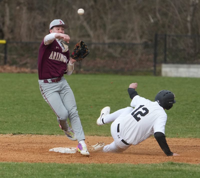 Arlington's DJ Mulvany forces out Scarsdale's Noah Kent breaks up a double play during their game at Scarsdale March 27, 2026. Arlington won 3-0.