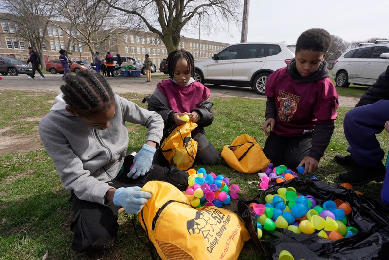 Brothers D.J., Jayden and Karter Reynolds look through the eggs they found at the Easter Egg Hunt held at Edgerton Park in Rochester on March 29, 2026. The event was sponsored by Barbers from Dream Cuts, Brothers & Sisters Unisex Salon, Sweet Ida Mae’s Pantry, and Tenth Ward Tigers Youth Sports.