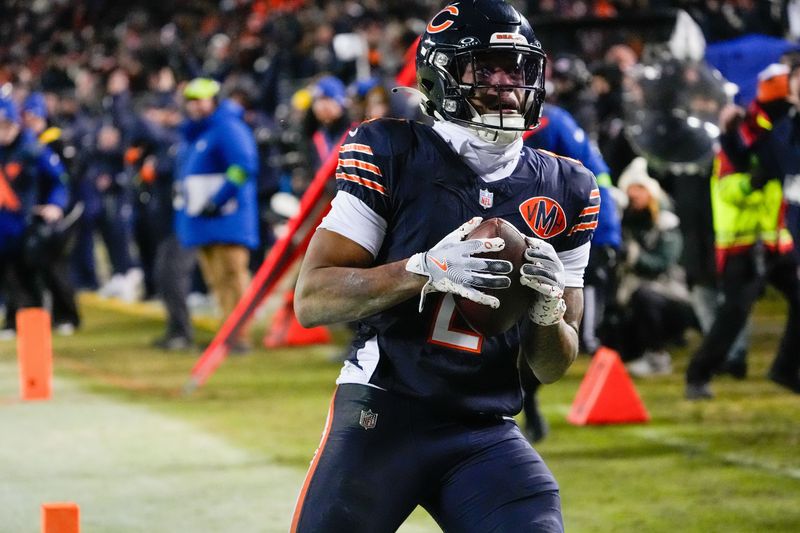 Jan 10, 2026; Chicago, IL, USA; Chicago Bears wide receiver DJ Moore (2) makes the eventual game winning touchdown catch against the Green Bay Packers during the second half of an NFC Wild Card Round game at Soldier Field. Mandatory Credit: David Banks-Imagn Images