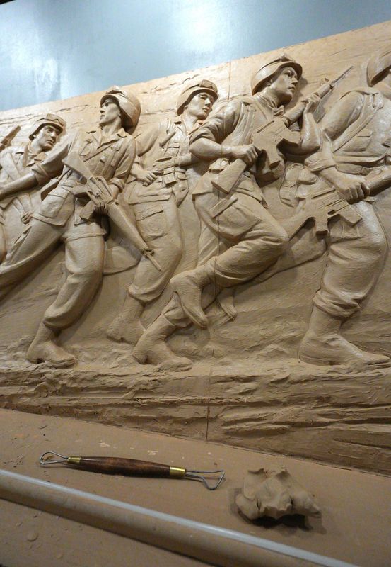 Emily Bedard, art director and lead scupltor for Foster Reeve, and artist behind the Desert Shield and Desert Storm Memorial, with her original clay creation of the memorial in her studio at the Garnerville Arts Center April 2, 2026.
