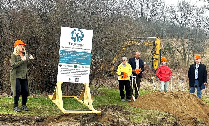 Elaine Smith, left, executive director of Tanglewood Nature Center in Elmira, discusses the center's new Treetop Walkway before she and others formally break ground for the $5 million project Friday, April 3, 2026.