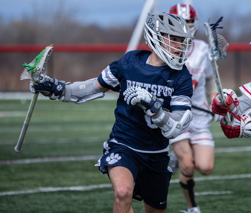 Pittsford's Jack Healy crosses the midline Saturday, April 4 at Canandaigua Academy.