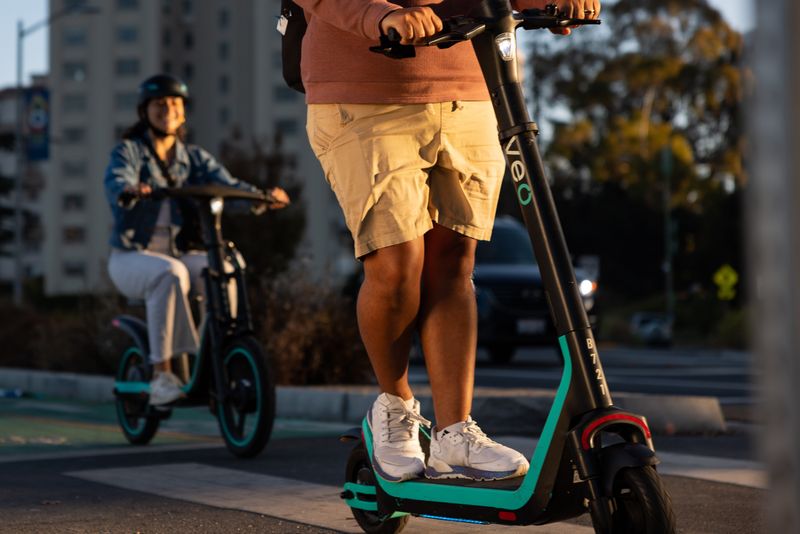 Two riders use a Veo e-bike and scooter.