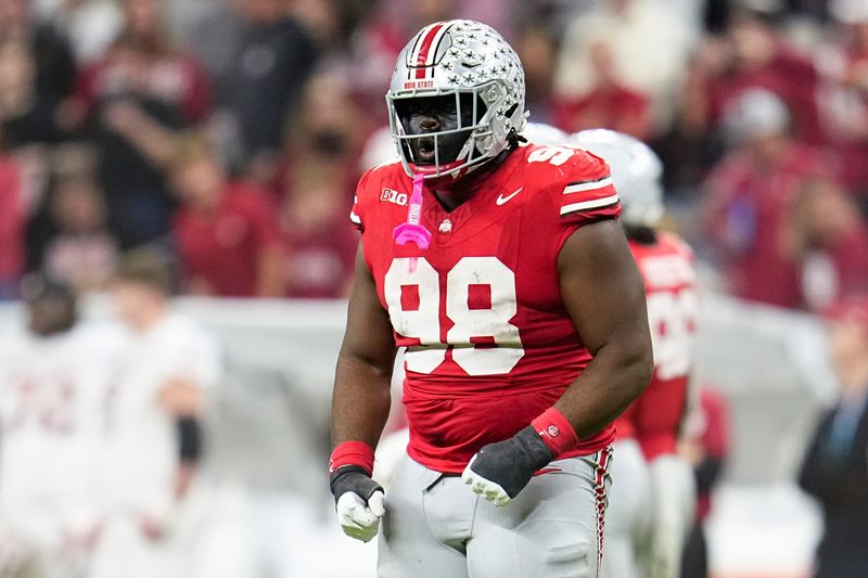 Ohio State Buckeyes defensive tackle Kayden McDonald (98) celebrates during the first half of the Big Ten Conference championship game against the Indiana Hoosiers at Lucas Oil Stadium in Indianapolis on Dec. 6, 2025.