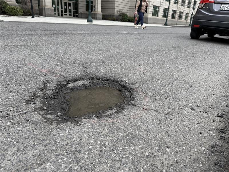 New York has plans to fill thousands of potholes across the state in 2026 after one of the coldest winters in memory. Shown here is a pothole on Broadway in downtown Albany on April 6, 2026.