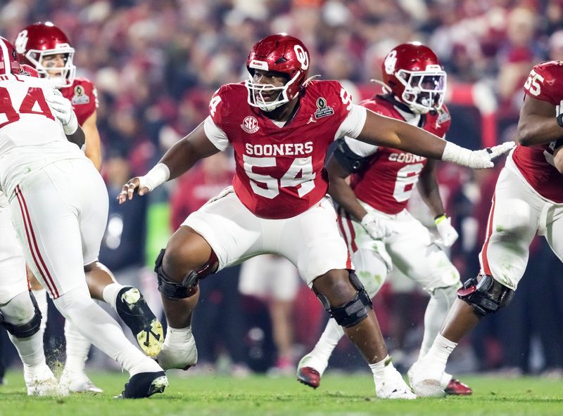 Dec 19, 2025; Norman, OK, USA; Oklahoma Sooners offensive lineman Febechi Nwaiwu (54) against the Alabama Crimson Tide during the CFP National Playoff First Round at Gaylord Family Oklahoma Memorial Stadium. Mandatory Credit: Mark J. Rebilas-Imagn Images