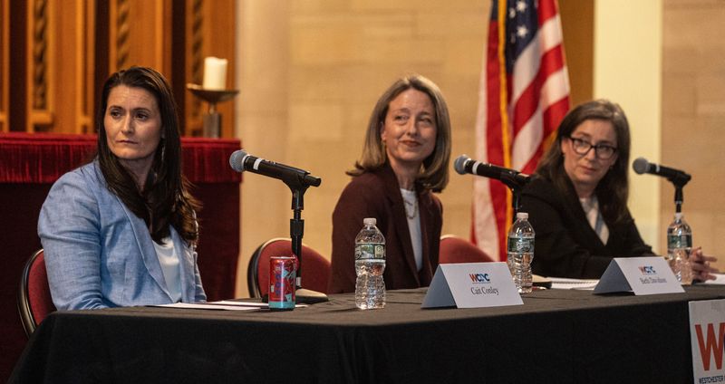 Democratic candidates Cait Conley, Beth Davidson and Effie Phillips-Staley listen to a question from the moderators during a debate April 9, 2026 as they vie for the June 23 primary to challenge Republican Rep. Mike Lawler for New York's 17th Congressional District seat. The debate was held in front of hundreds at the O'Byrne Chapel at Manhattanville University in Purchase.