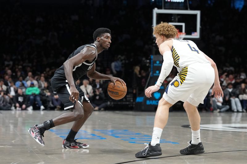 Apr 9, 2026; Brooklyn, New York, USA; Brooklyn Nets guard Drake Powell (4) dribbles the ball against Indiana Pacers guard Taelon Peter (4) during the first half at Barclays Center. Mandatory Credit: Gregory Fisher-Imagn Images