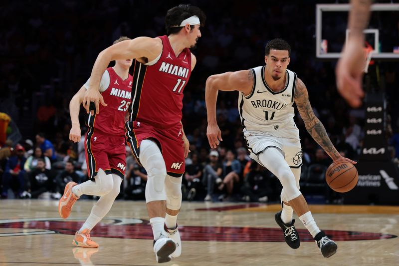 Mar 5, 2026; Miami, Florida, USA; Brooklyn Nets forward Michael Porter Jr. (17) drives to the basket against Miami Heat forward Jaime Jaquez Jr. (11) during the first quarter at Kaseya Center. Mandatory Credit: Sam Navarro-Imagn Images