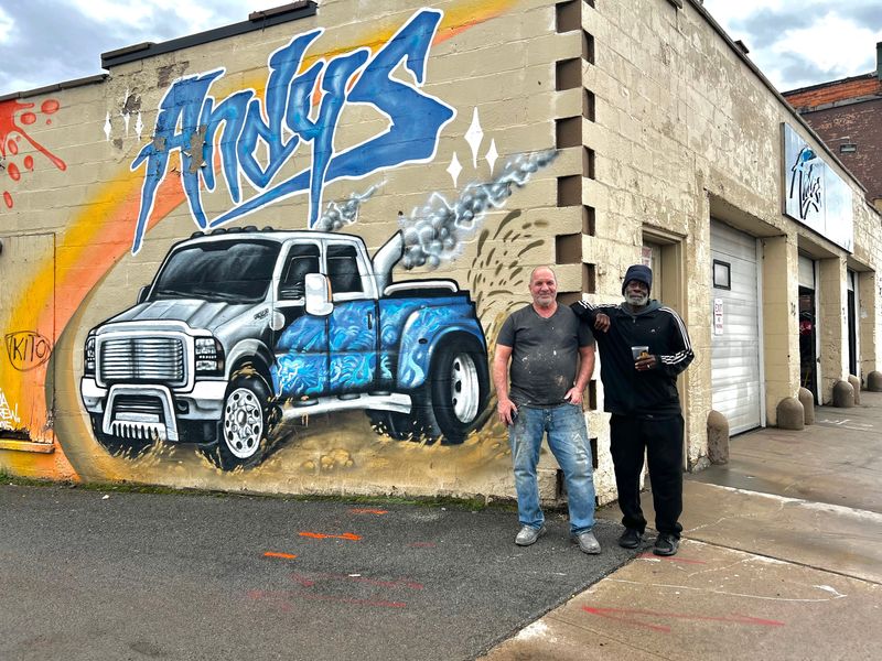 Francis "Andy" Winterkorn (left) stands in front of Andy's Auto Enhancements with his good friend Andrew Redding (right) at 22 York St. in the Bull's Head Neighborhood.