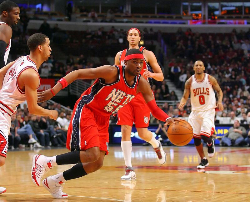 Mar 27, 2010; Chicago, IL, USA; New Jersey Nets guard Keyon Dooling (55) drives past Chicago Bulls guard Jannero Pargo (2) during the second half at the United Center. The Bulls defeated the Nets 106-83. Mandatory Credit: Dennis Wierzbicki-USA TODAY Sports