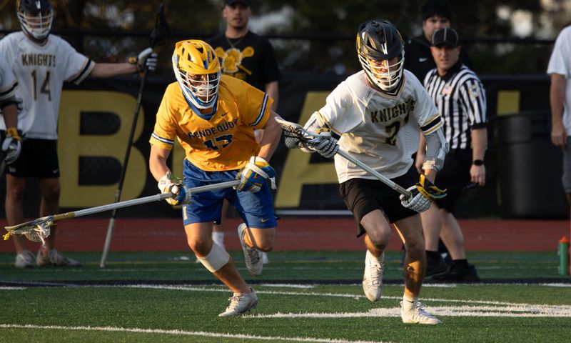 McQuaid's Bryce Pitt races toward the cage Tuesday, April 14 at McQuaid Jesuit High School.