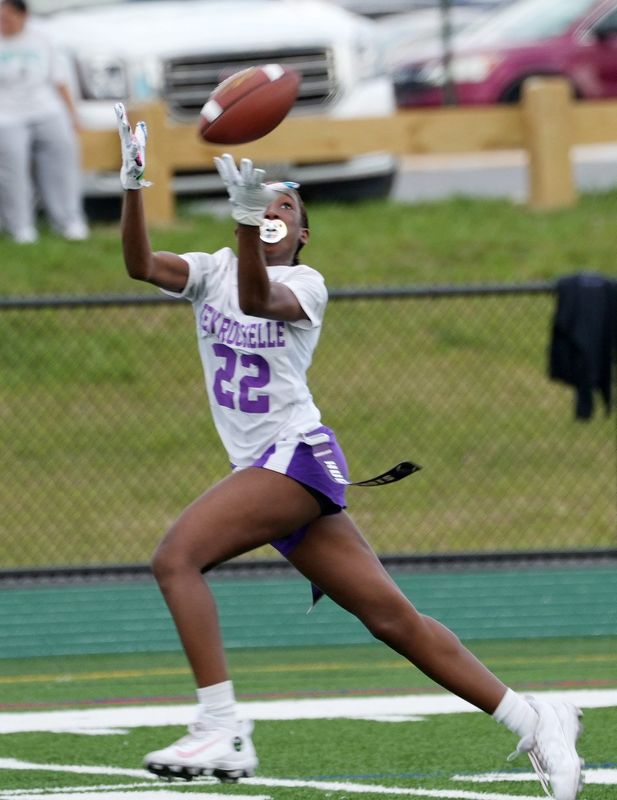 New Rochelle’s Hope Ziogas (22) catches a touchdown pass against Brewster during flag football action at Brewster High School April 15, 2026. New Rochelle won the game 19-0.