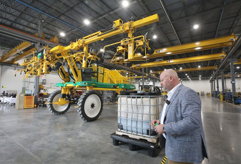 Oxbo Plant Manager Chris Chadbourne leads a tour through the assembly department at the grand opening of the new Oxbo advanced manufacturing facility in Bergen, Wayne County, Thursday, April 16, 2026. The Bergen facility will design and manufacturer harvesters for specialty crops such as seed corn, sweet corn, green beans, and peas.