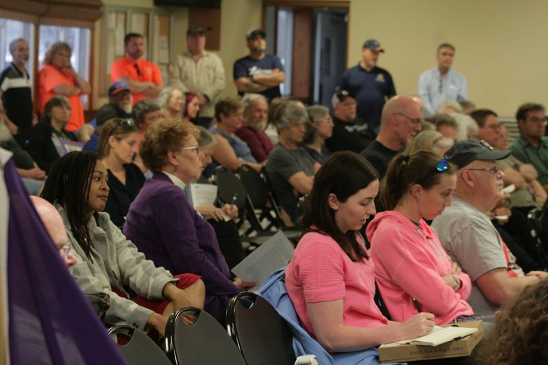 The audience listens to comments from residents at a public hearing on a proposed data center in Alabama, Genesee County on April 16, 2026.