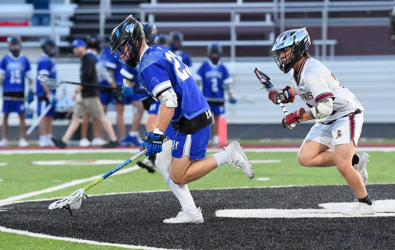 Horseheads' Boe Briggs (23) wins a faceoff during an 8-7, four-overtime win over Elmira in boys lacrosse April 17, 2026 at Elmira High School's Thomas J. Hurley Athletic Complex.