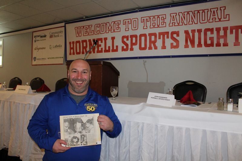Sports Night Committee member John Rosemier displays a copy of a 1995 edition of the Hornell Evening Tribune that featured a photo of him as a youth with Joe Frazier. Rosemier is now helping lead Sports Night into its sixth decade.