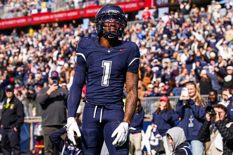 Nov 1, 2025; East Hartford, Connecticut, USA; UConn Huskies wide receiver Skyler Bell (1) reacts after his touchdown against the UAB Blazers in the second quarter at Pratt & Whitney Stadium at Rentschler Field. Mandatory Credit: David Butler II-Imagn Images