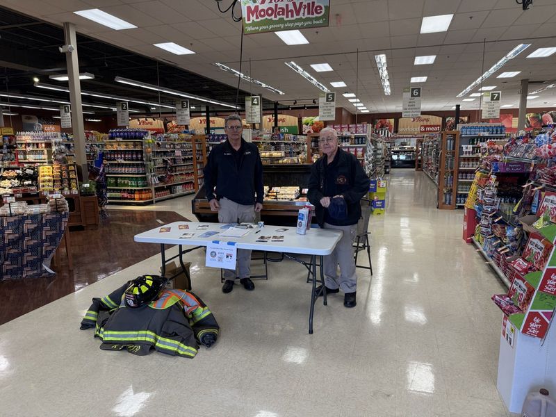 Bill Halline, a Painted Post firefighter for the past 55 years, and Painted Post Fire Department Vice President Bob Smith provided information April 18, 2026 at Top's Friendly Market in Riverside during the 14th annual RecruitNY Weekend to attract new volunteers.