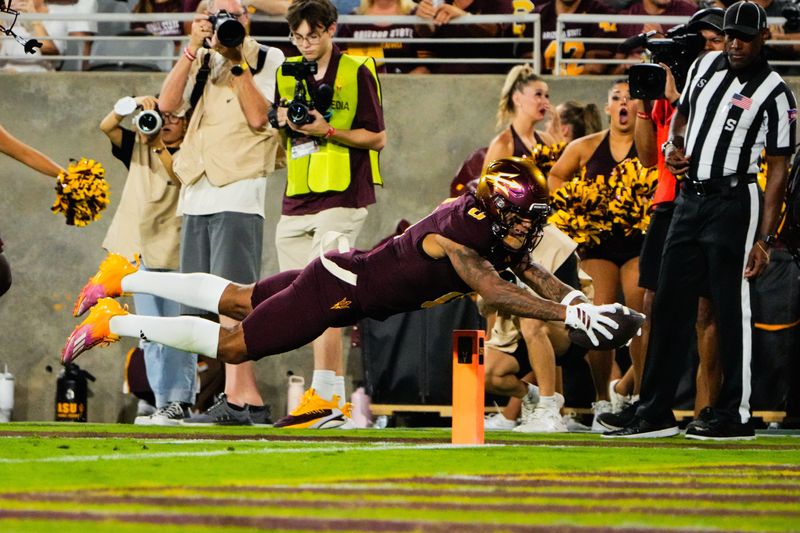 Sep 13, 2025; Tempe, Arizona, USA; Arizona State Sun Devils wide receiver Jordyn Tyson (0) dives into the end zone in the second quarter of the game between Arizona State Sun Devils and Texas State Bobcats. Mandatory Credit: Arianna Grainey-Imagn Images