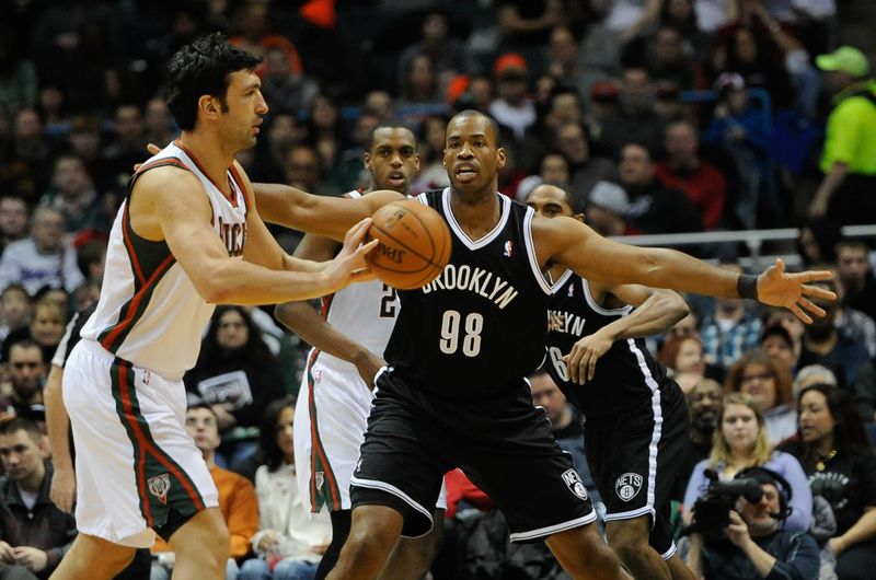 Mar 1, 2014; Milwaukee, WI, USA; Brooklyn Nets center Jason Collins (98) guards Milwaukee Bucks center Zaza Pachulia (27) in the 2nd quarter at BMO Harris Bradley Center. Mandatory Credit: Benny Sieu-USA TODAY Sports